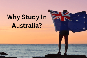 A man is standing with an Australian flag and why study in Australia written on the side.